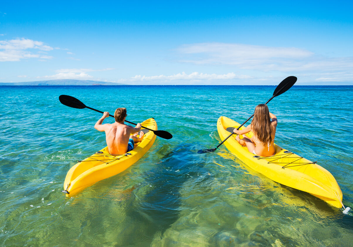 Couple Kayaking in the Ocean on Vacation
