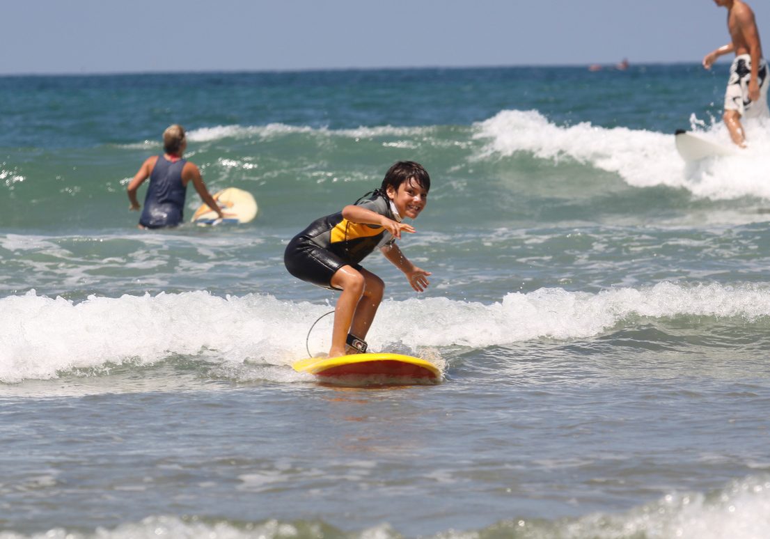 happy boy surfing